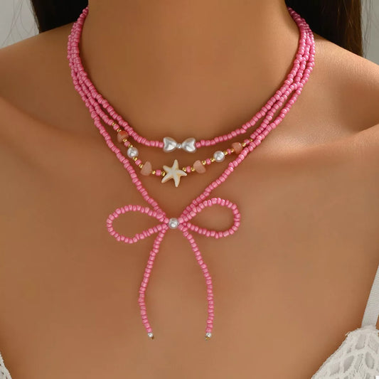 Beaded Three-Layered Necklace with Bow and Starfish Charms